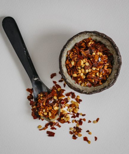 substitute, what is Red chili flakes, which are made from dried, crushed red chili peppers, offer a bold, spicy heat and a vibrant color that can enhance a wide range of dishes from pizzas and pastas to stir-fries and soups, and if red chili flakes are unavailable, they can be substituted with cayenne pepper for a similar level of heat, though cayenne lacks the texture and slight smokiness of chili flakes, or with a mix of hot paprika and a pinch of dried red pepper to approximate both the spiciness and the visual appeal of red chili flakes.