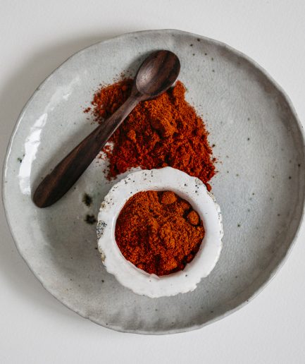 what is Sweet paprika, which is a ground spice made from dried, ripe red peppers, is characterized by its vibrant red color and mild, subtly sweet flavor with very little heat, making it a versatile ingredient used to add a gentle depth of flavor and an appealing hue to a variety of dishes, including stews, soups, and roasted vegetables, while also serving as a key component in spice blends and seasoning mixes where its sweetness and color can enhance the overall profile of the culinary creation.