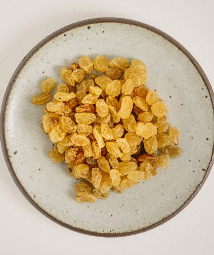 raisins, Golden sultanas, which are plump, juicy, and sweet dried grapes with a slightly tangy flavor and a golden hue achieved through drying in a controlled environment with sulfur dioxide, can be used in a variety of culinary applications such as adding natural sweetness and moisture to baked goods like cakes and breads, enhancing the texture and flavor of salads, cereals, and trail mixes, and incorporating into savory dishes like pilafs and tagines, and they can be considered a type of raisin, distinguished by their lighter color and milder, fruitier taste compared to the darker, more robust flavor of traditional raisins.