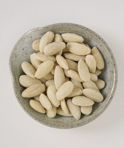 what are, Blanched almonds, which are almonds that have had their skins removed through a process of briefly boiling and then plunging them into cold water, resulting in a smooth, pale white nut with a slightly softer texture compared to unblanched almonds, are commonly used in various culinary applications such as making almond flour, adding to pastries and baked goods for a refined texture and mild flavor, or incorporating into sauces and soups to create a creamy consistency, while also being valued for their versatility in recipes that require a delicate nut flavor without the slightly bitter taste of the almond skin.